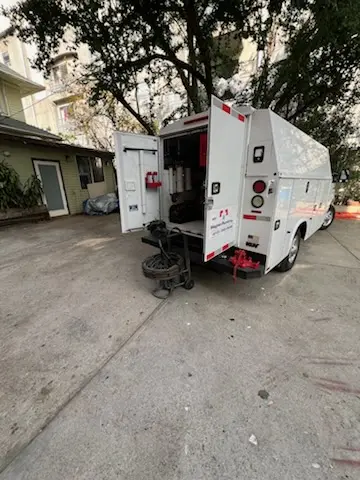 Magnet Plumbing service vehicle on-site for Grease Trap Cleaning in Regal Estates